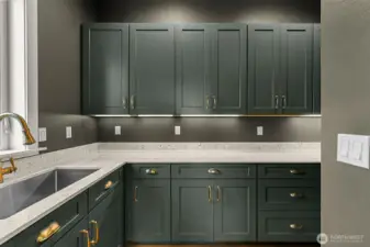 Butlers Pantry with second sink, lots of cabinet and counter space.