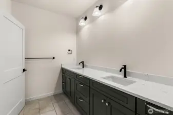 Nicely sized lower level full bath with separate private dual vanity from water closet/tub/shower
