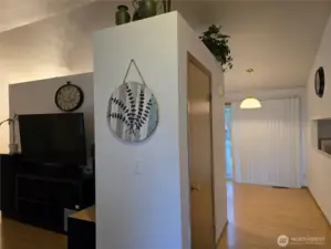 Entrance to home with living room to the left and kitchen eating area straight ahead.