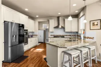Stainless steel appliance in kitchen. New fridge and stove top