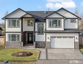 Welcome to this 2024 built, custom home in Buckley