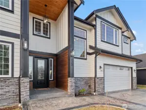 Stamped concrete driveway & walkway leads to a beautiful front entrance. So many articulate details and accents that make this home stand out.