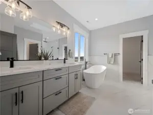 5 piece primary bathroom with dual vanity sinks.
