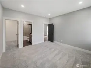 Guest bedroom #1 with full bath & walk-in closet.
