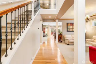 A grand entry with millwork that makes a statement, hardwood floors that shine from the front and to the back of the house.