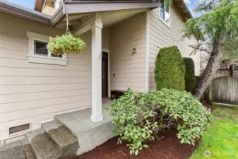 Covered front porch. Fresh mulch added to all the garden beds.