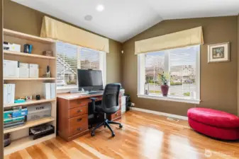 Main floor bedroom with wood floors, also makes a great guest suite or work from home office.  Adjacent 3/4 bath next door.