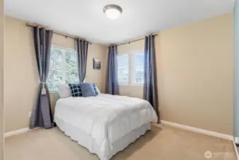 Corner window bedroom with a generous closet. Queen sized bed.