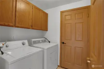 Don't overlook the laundry room! Nice storage here and this space acts like a convenient mud room when coming in from the garage. The washer and dryer are included in the sale!