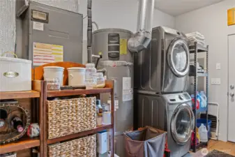 Nice size laundry room with XL hot water tank.