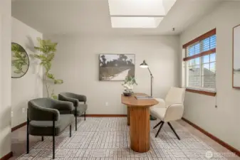 French doors open to this bedroom with skylights at the top of the stairs. This space would also be perfect for an office, studio or playroom.