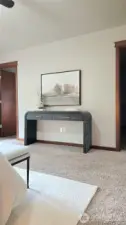 The door to the left leads to the primary bathroom and the door to the right leads to the walk-in-closet.