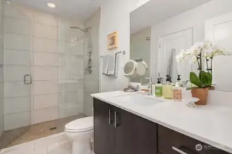 Primary bath has en-suite access from the primary bedroom or can be used by the second bedroom via access from the hallway.  It's a thoughtful design for dual purpose with the occasional guest access.