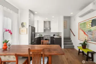 From the living room this photo looks at the kitchen. The open floor plan allows the cook to visit with guests.