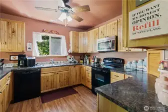 Ample cabinetry provides generous storage throughout the kitchen.