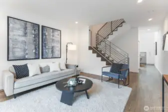 Come up from ground- level to the bright, main living area.