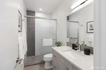 Just a couple steps from Primary bedroom is the 3/4 newer bath (tub was converted to walk-in shower last year).