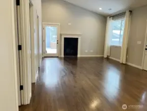 ADU kitchen opens to family room with gas fireplace