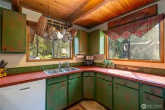 The kitchen looks over the front deck