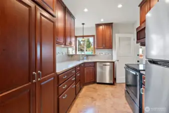 updated kitchen featuring quality cabinets.