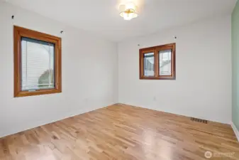 Main-level bedrooms with original hardwood