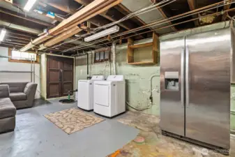 Spacious laundry and stoage area.