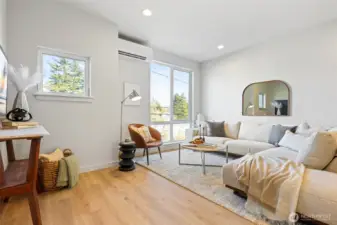 Let the natural light pour in. This airy living room has warm tones, soft textures, and modern edges.