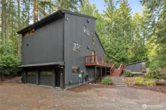 Discreet 2 garage tucked under the home.