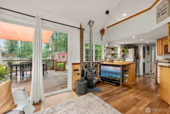 Living room with vaulted ceilings and natural light creates a comfortable, open atmosphere.