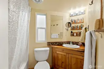 Bathroom features a space-efficient layout designed for comfort and easy maintenance.