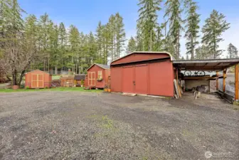 Detached garage and workshop with attached carport for parking, storage, or projects.