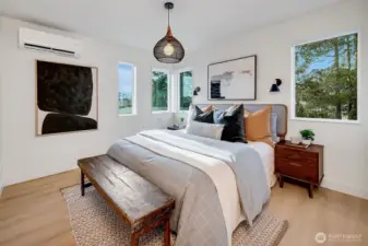 Primary top-floor ensuite with large tiled shower, a spacious walk-in closet, custom lighting, and restful design.