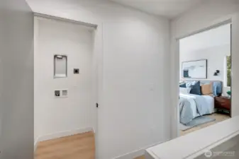 Convenient washer and dryer hook-ups in the utility room, located adjacent to the primary suite.