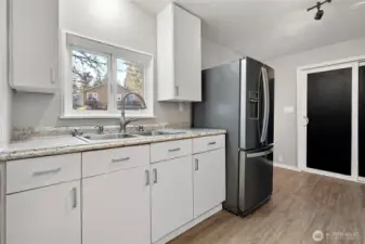 Kitchen with back doors into shop space