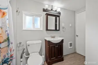 Full Bathroom- jack and Jill from primary and into hallway by laundry room