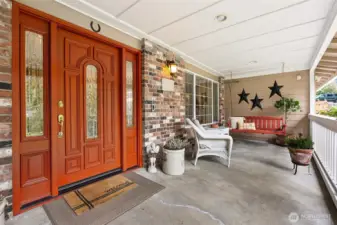 Covered front porch provides additional living space.