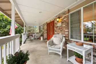 You can see the porch covers the whole front of the home.