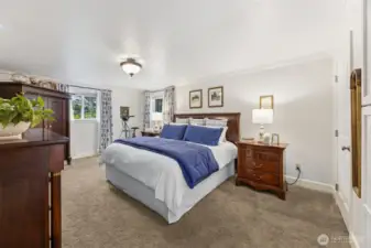 Large primary bedroom with walk in closet.