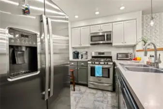 Another view of this nice kitchen featuring the new refrigerator front and center here.