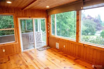 Enclosed sunroom with views of mountains over Snohomish valley.
