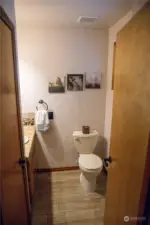 Half bathroom next to dining room.