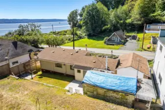 Looking from the upper terrace. Small pocket community located along sandy beaches.