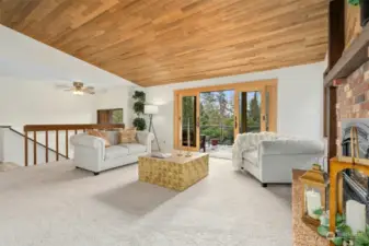 Large living room with french doors to the front deck made of Ironwood.