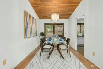 Dining room with access to the kitchen and back deck.