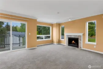 Living room with terrific natural light, fireplace and balcony