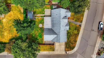 larger fully fenced corner lot with side driveway to garage and plenty of wide street parking