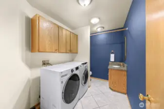Spacious Laundry room / half bath off kitchen with almost new large load washer/dryer