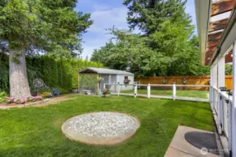 Mature landscaping & fencing make th perfect backyard
