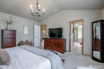 Primary Bedroom has Vaulted Ceilings, nice window for letting in the daylight, a huge walk in closet, 5 piece bath + large vanity.