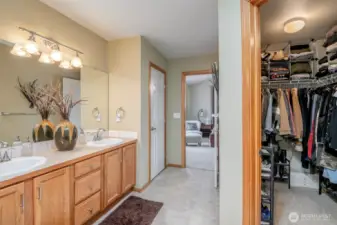 Primary Bedroom has Vaulted Ceilings, nice window for letting in the daylight, a huge walk in closet, 5 piece bath + large vanity.